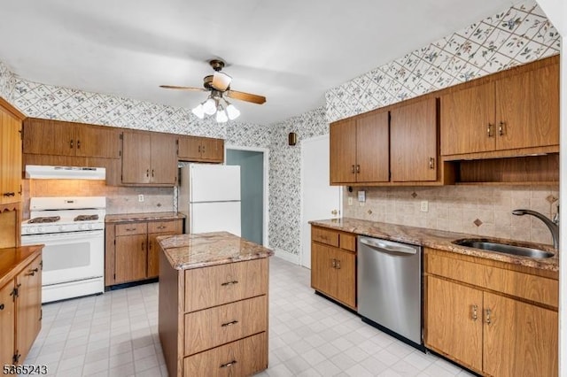 13 S St, Madison Boro, NJ 07940 - kitchen with white appliances, under cabinet range hood, wallpapered walls, ceiling fan, and a center island