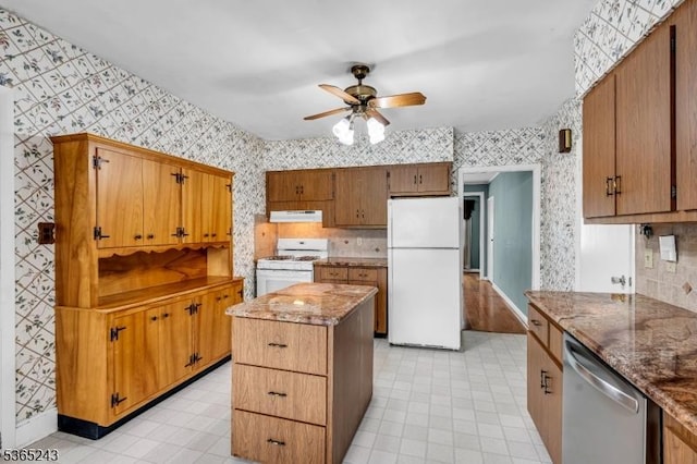 13 S St, Madison Boro, NJ 07940 - kitchen with white appliances, wallpapered walls, under cabinet range hood, ceiling fan, and a kitchen island