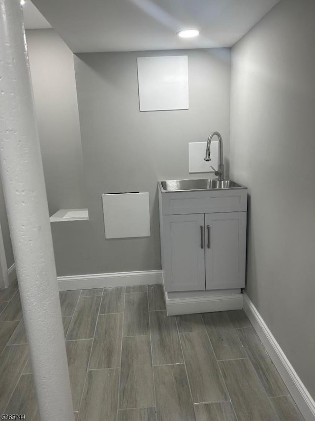 14 Guenther Pl, Passaic City, NJ 07055 - bathroom with wood tiled floors and vanity