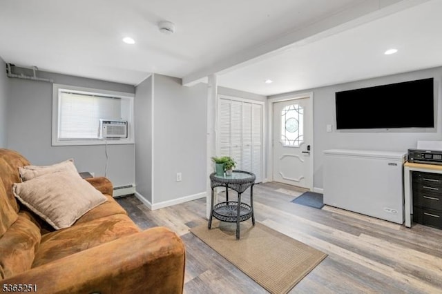 67 Riverview Ave, Lincoln Park Boro, NJ 07035 - living area featuring baseboard heating, light wood-type flooring, and recessed lighting
