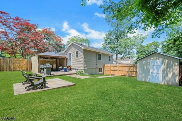 67 Riverview Ave, Lincoln Park Boro, NJ 07035 - back of house featuring a gazebo, a storage shed, a patio, and a fenced backyard