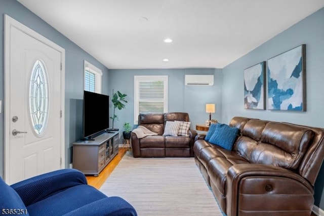 67 Riverview Ave, Lincoln Park Boro, NJ 07035 - living area with a wall unit AC, light wood-style flooring, and recessed lighting