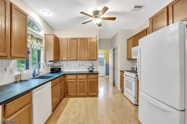 23 Estate Dr, Wantage Twp, NJ 07461 - kitchen featuring white appliances, dark countertops, light wood-style flooring, tasteful backsplash, and ceiling fan