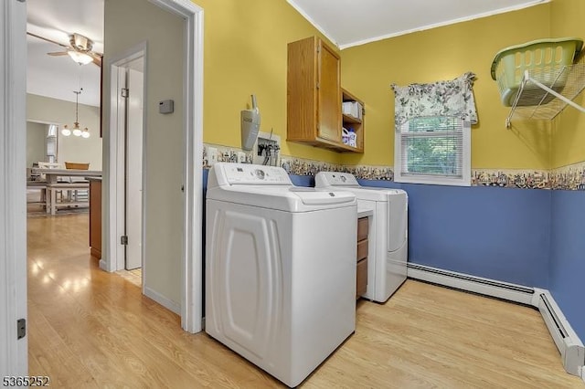 23 Estate Dr, Wantage Twp, NJ 07461 - laundry area featuring washer and clothes dryer, plenty of natural light, light wood-style floors, baseboard heating, and ornamental molding