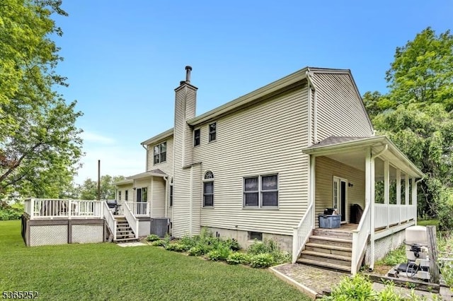 23 Estate Dr, Wantage Twp, NJ 07461 - back of property featuring a chimney, a yard, a deck, and stairs
