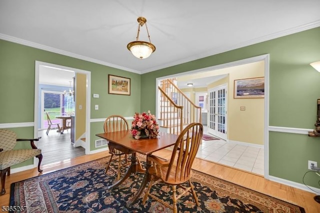 8 Dahn Dr, Sparta Twp, NJ 07871 - dining room with light wood finished floors, ornamental molding, stairs, and a chandelier
