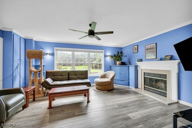 8 Dahn Dr, Sparta Twp, NJ 07871 - living area featuring ornamental molding, ceiling fan, wood finished floors, and a glass covered fireplace