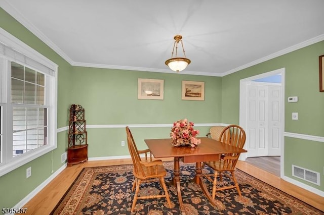 8 Dahn Dr, Sparta Twp, NJ 07871 - dining area with light wood-style flooring and crown molding