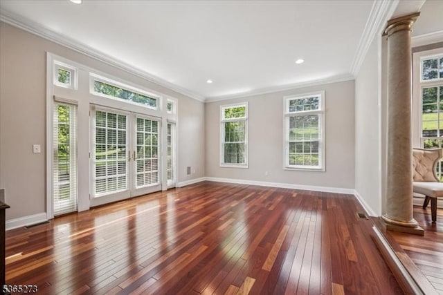 7 Sycamore Dr, Chatham Twp, NJ 07928 - unfurnished living room with decorative columns, ornamental molding, french doors, dark wood-style flooring, and healthy amount of natural light