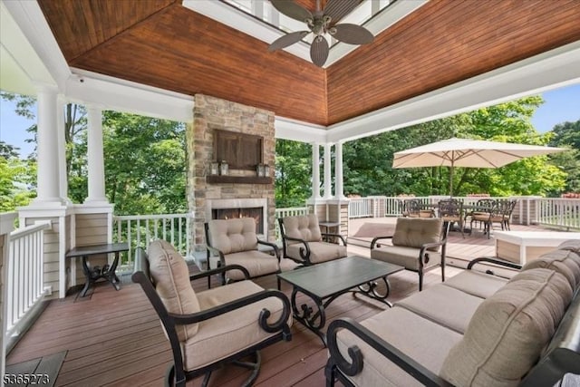 7 Sycamore Dr, Chatham Twp, NJ 07928 - wooden deck with an outdoor living space with a fireplace, a ceiling fan, and outdoor dining space