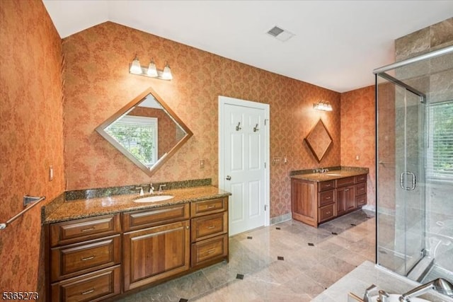 7 Sycamore Dr, Chatham Twp, NJ 07928 - bathroom featuring two vanities, a shower stall, and vaulted ceiling