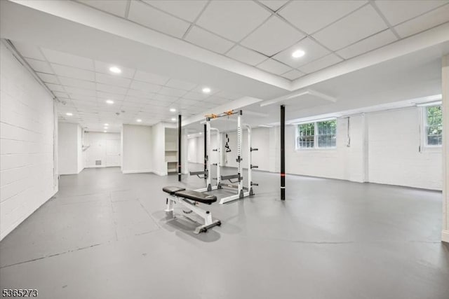 7 Sycamore Dr, Chatham Twp, NJ 07928 - workout area with concrete block wall, plenty of natural light, a paneled ceiling, and recessed lighting