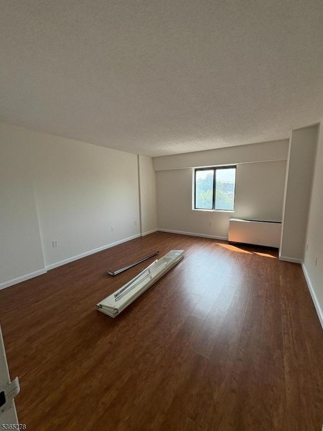 10 N Wood Ave Unit 316, Linden City, NJ 07036 - empty room featuring wood finished floors and baseboards