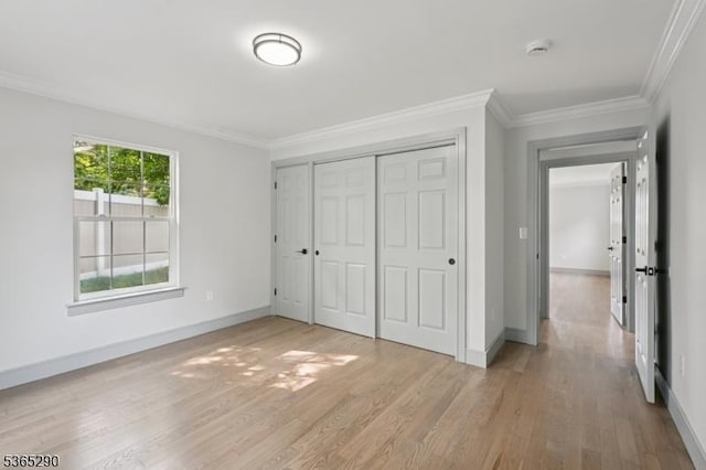 126 Cooney Ave, Hamilton Twp, NJ 08619 - unfurnished bedroom featuring light wood-type flooring, ornamental molding, and a closet