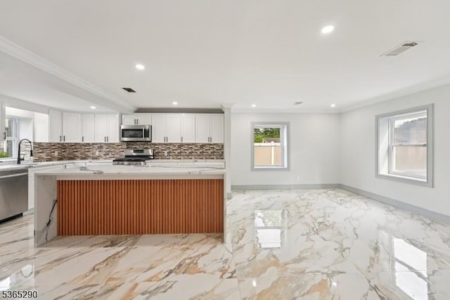 126 Cooney Ave, Hamilton Twp, NJ 08619 - kitchen with stainless steel appliances, crown molding, white cabinets, tasteful backsplash, and recessed lighting