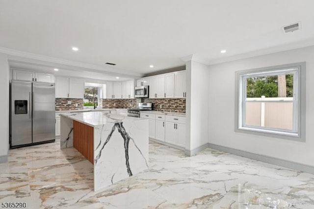 126 Cooney Ave, Hamilton Twp, NJ 08619 - kitchen featuring appliances with stainless steel finishes, crown molding, healthy amount of natural light, tasteful backsplash, and recessed lighting