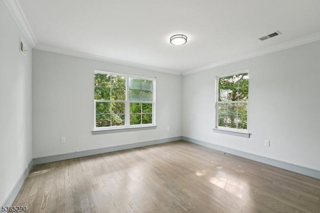 126 Cooney Ave, Hamilton Twp, NJ 08619 - empty room with plenty of natural light, crown molding, and wood finished floors