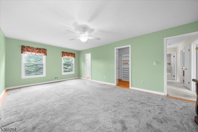 10 Duke Ct, Franklin Twp, NJ 08867 - unfurnished bedroom with carpet floors, ceiling fan, and a walk in closet