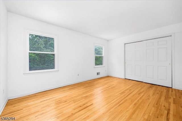 10 Duke Ct, Franklin Twp, NJ 08867 - unfurnished bedroom featuring light wood-style flooring and a closet