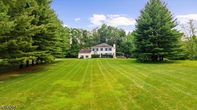 10 Duke Ct, Franklin Twp, NJ 08867 - view of grassy yard featuring a view of trees