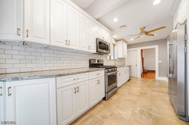 103 Cedar St, Nutley Twp, NJ 07110 - kitchen with appliances with stainless steel finishes, ceiling fan, white cabinetry, recessed lighting, and backsplash