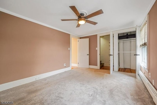 103 Cedar St, Nutley Twp, NJ 07110 - unfurnished bedroom featuring a baseboard heating unit, carpet, ornamental molding, multiple closets, and ceiling fan