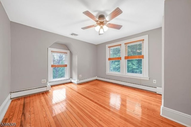 103 Cedar St, Nutley Twp, NJ 07110 - unfurnished room featuring a baseboard radiator, wood finished floors, and a ceiling fan