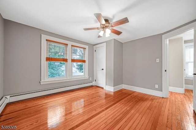 103 Cedar St, Nutley Twp, NJ 07110 - spare room with light wood-style flooring, ceiling fan, and a baseboard radiator
