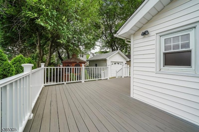 103 Cedar St, Nutley Twp, NJ 07110 - wooden terrace featuring an outbuilding and a garage