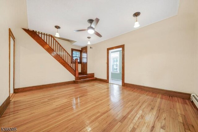 103 Cedar St, Nutley Twp, NJ 07110 - unfurnished living room with ceiling fan, stairs, and light wood-style flooring