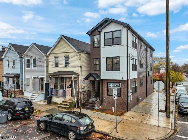 613 S 18th St, Newark City, NJ 07103 - view of property featuring brick siding and board and batten siding