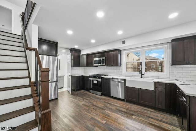 613 S 18th St, Newark City, NJ 07103 - kitchen featuring appliances with stainless steel finishes, backsplash, dark wood-type flooring, recessed lighting, and dark brown cabinetry