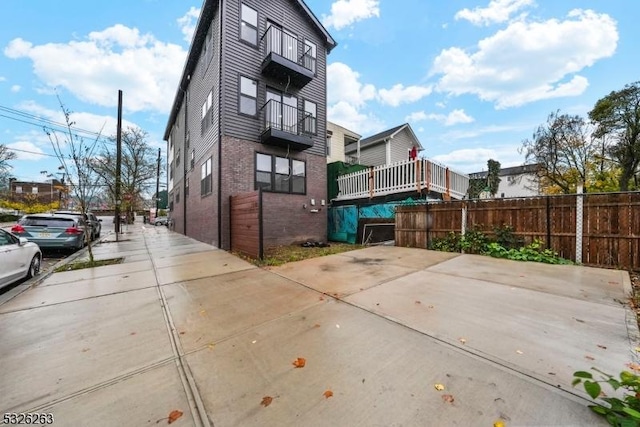 613 S 18th St, Newark City, NJ 07103 - rear view of house with brick siding and a balcony