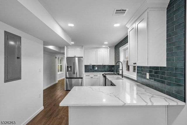 613 S 18th St, Newark City, NJ 07103 - kitchen with stainless steel fridge with ice dispenser, electric panel, light stone counters, white cabinetry, and recessed lighting