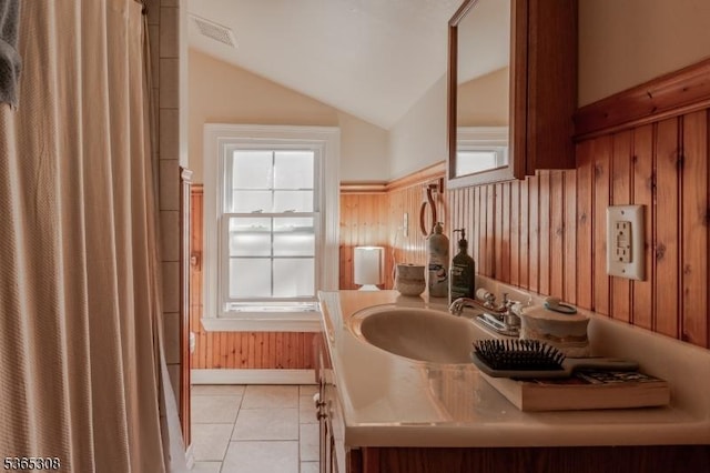 104 W Emerson Ave, Rahway City, NJ 07065 - full bath featuring vaulted ceiling, tile patterned floors, vanity, curtained shower, and a wainscoted wall