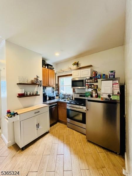 52 Sargeant Ave, Clifton City, NJ 07013 - kitchen with stainless steel appliances and light wood finished floors