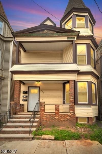 160 S 11th St, Newark City, NJ 07107 - view of front of property featuring brick siding and a porch
