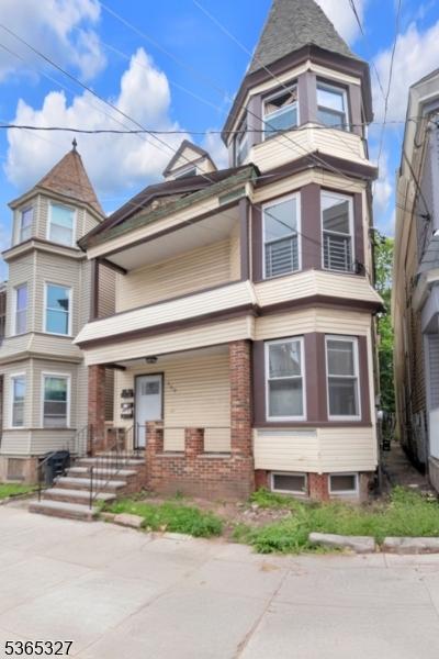 160 S 11th St, Newark City, NJ 07107 - victorian house with covered porch and brick siding