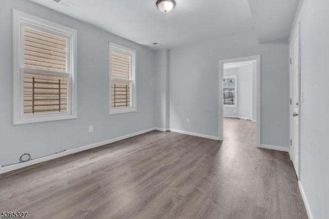 160 S 11th St, Newark City, NJ 07107 - empty room with wood finished floors and plenty of natural light