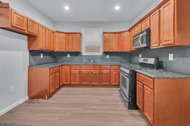 160 S 11th St, Newark City, NJ 07107 - kitchen with stainless steel appliances, brown cabinets, recessed lighting, and light wood-type flooring