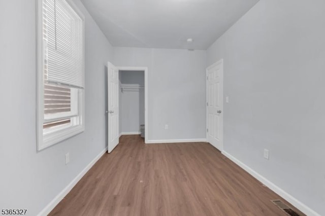 160 S 11th St, Newark City, NJ 07107 - unfurnished bedroom with wood finished floors and a closet