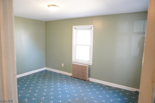 573 Conant St, Hillside Twp, NJ 07205 - carpeted empty room featuring radiator heating unit and baseboards