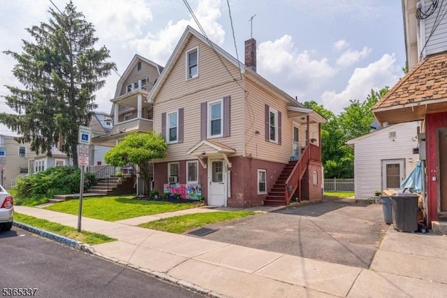 305 W Clay Ave, Roselle Park Boro, NJ 07204 - view of front of home with stairway and a chimney