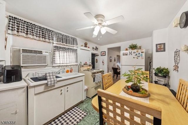 305 W Clay Ave, Roselle Park Boro, NJ 07204 - kitchen with white appliances, light countertops, a ceiling fan, and an AC wall unit