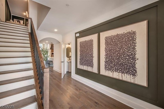 16 Whitaker Ln, Far Hills Boro, NJ 08873 - entrance foyer with arched walkways, wood finished floors, ornamental molding, stairs, and recessed lighting