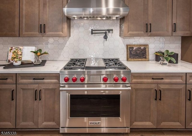 16 Whitaker Ln, Far Hills Boro, NJ 08873 - kitchen with luxury range, wall chimney exhaust hood, decorative backsplash, and light stone counters