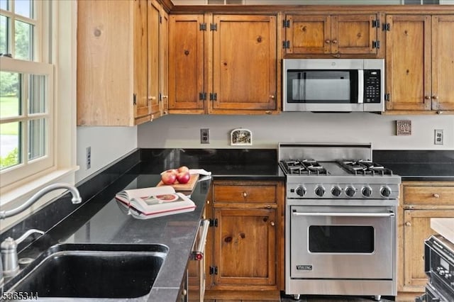 153 Lambertville Hq Rd, Delaware Twp, NJ 08559 - kitchen featuring appliances with stainless steel finishes, brown cabinets, and dark countertops