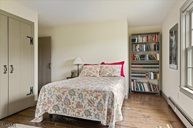 153 Lambertville Hq Rd, Delaware Twp, NJ 08559 - bedroom featuring a baseboard heating unit and hardwood / wood-style floors