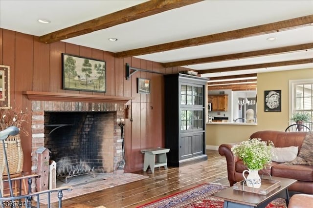 153 Lambertville Hq Rd, Delaware Twp, NJ 08559 - living area featuring wood finished floors, beam ceiling, a brick fireplace, and wooden walls