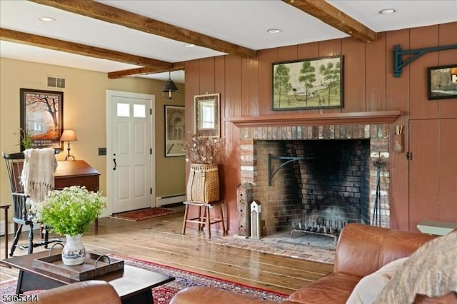 153 Lambertville Hq Rd, Delaware Twp, NJ 08559 - living area with wood finished floors, a baseboard heating unit, a brick fireplace, beam ceiling, and recessed lighting